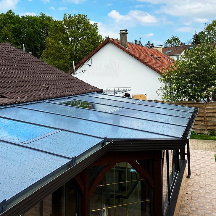 Isolation toiture véranda panneaux sandwich et verre